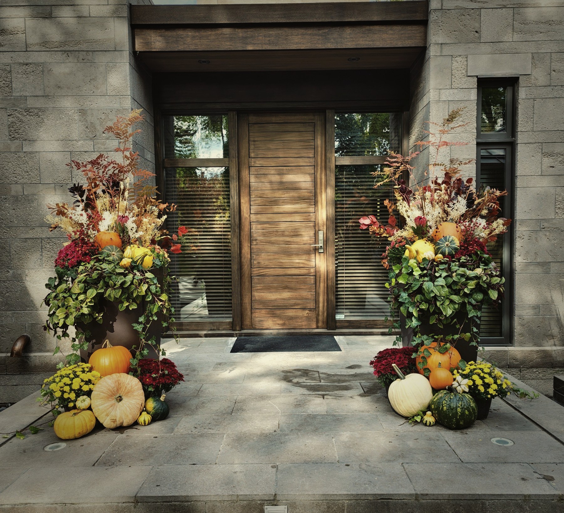Autumn planters at a modern entrance